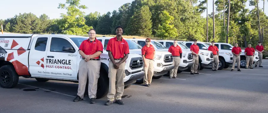 tpc techs standing next to trucks