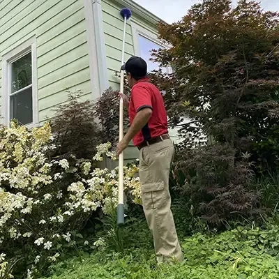 Tech sweeping exterior of home