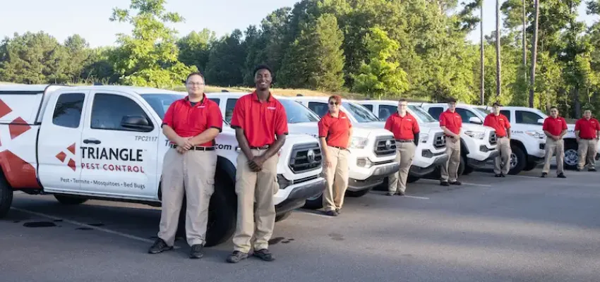 tpc techs standing next to trucks