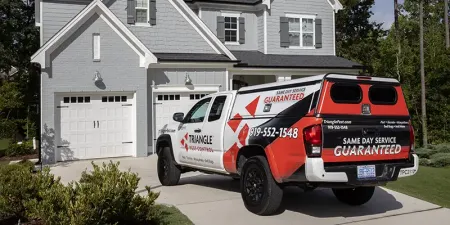 Triangle Pest Control Truck in Driveway