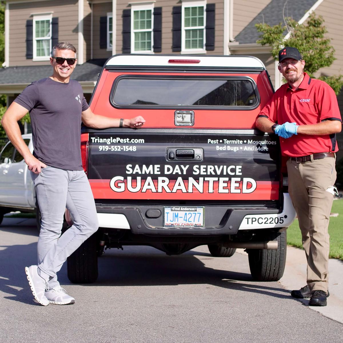 Donnie and technician outside of truck