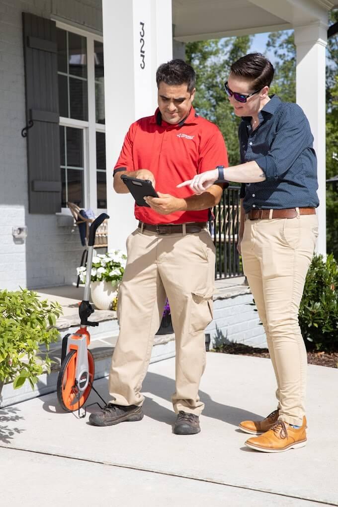 Technician and homeowner talking