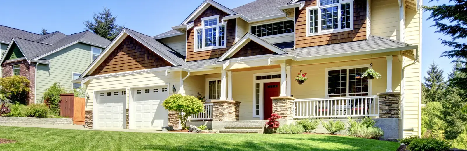 house with blue sky and green lawn