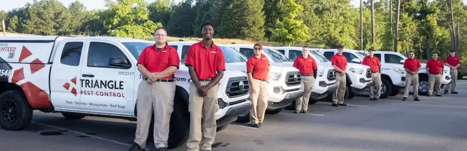 tpc techs standing next to trucks