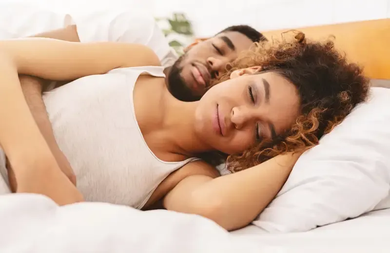couple sleeping peacefully in bed bug free bed