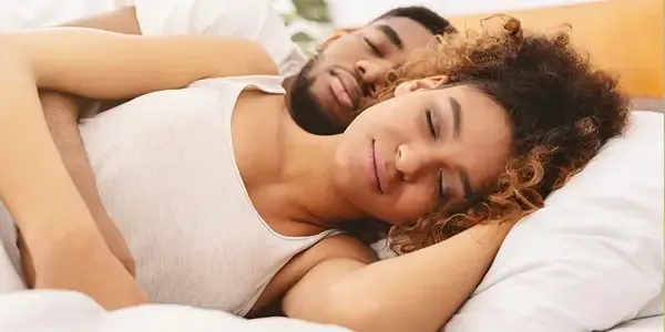couple sleeping peacefully in bed bug free bed, bed bug control service