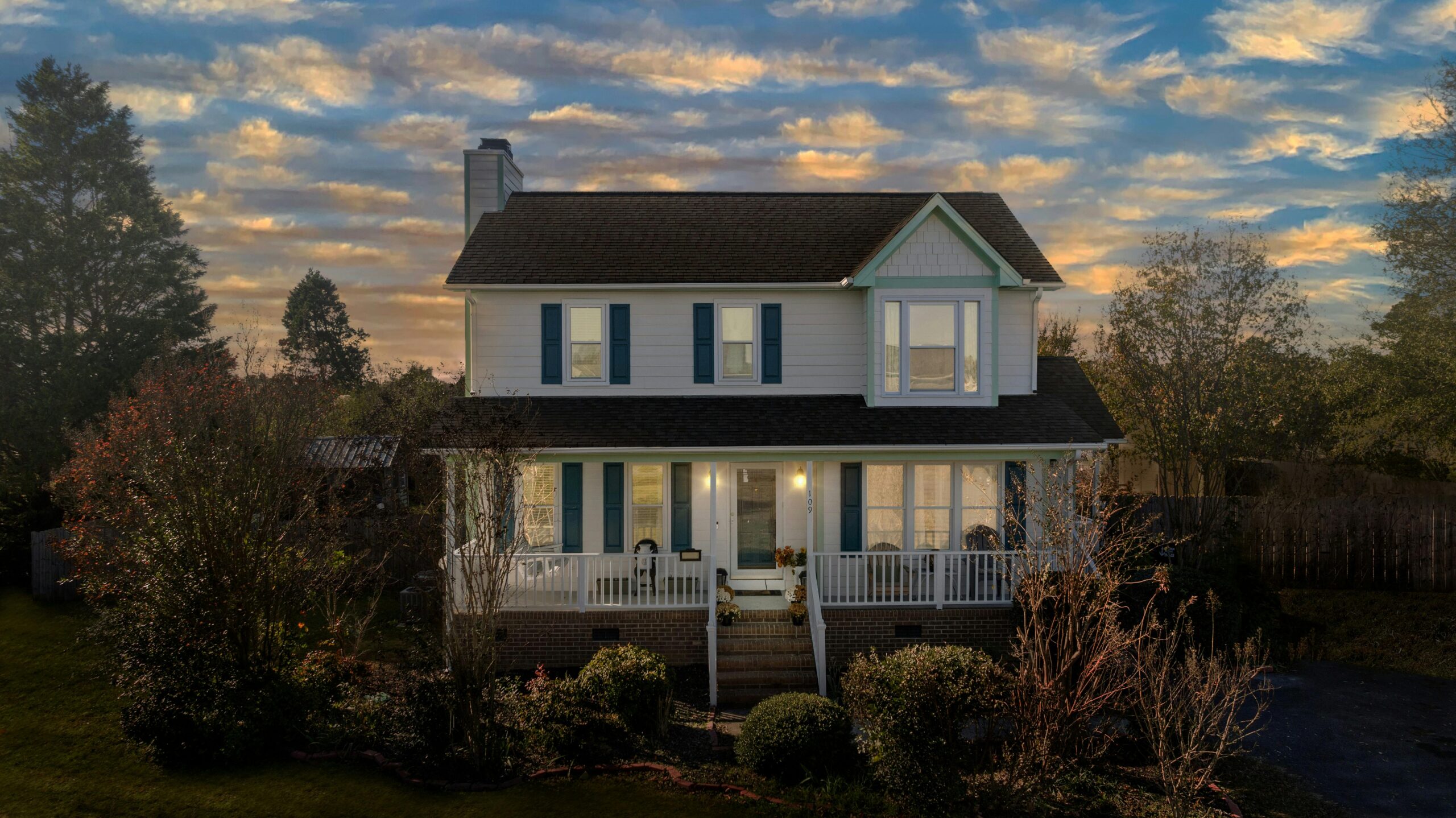 Charlotte home in late fall with winter lighting, representing hidden winter pest activity inside homes.