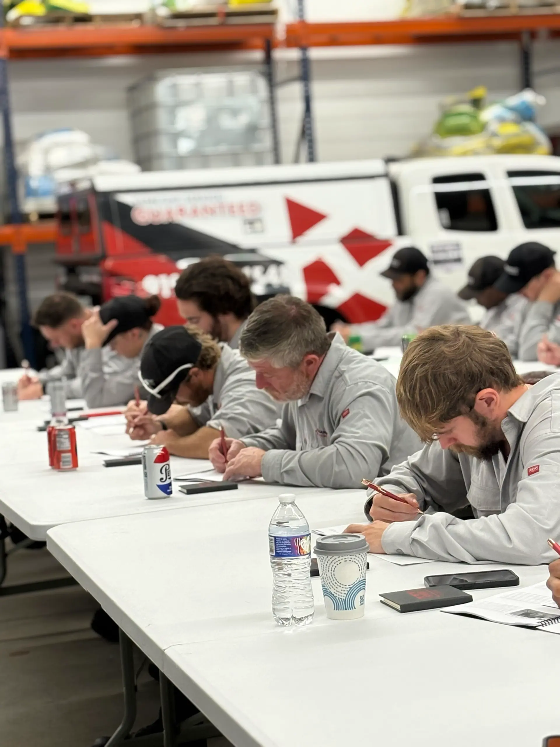 Triangle Pest Control technician participating in hands-on diagnostic training during an NC State university workshop