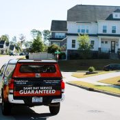 Professional termite control service in Raleigh with Triangle Pest Control truck in residential neighborhood